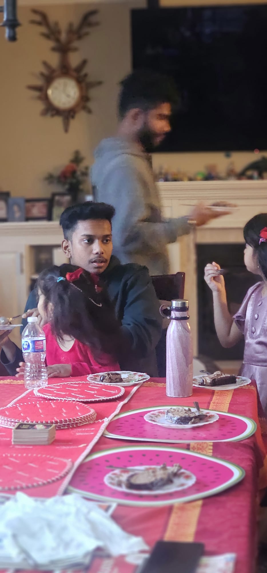Sonu spending time with children around a table